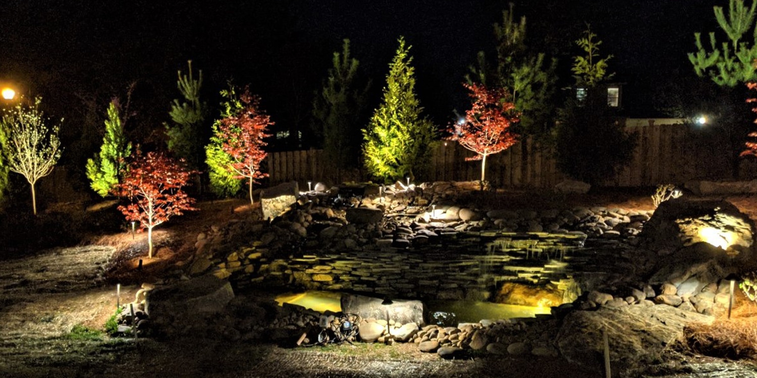 Outdoor lighting designed to compliment a hardscape fountain.
